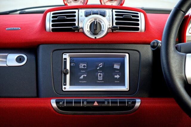 modern car dashboard with indicators like airbag light